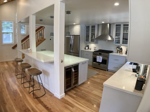 Beautiful chef's kitchen with enormous island and kitchen prep area