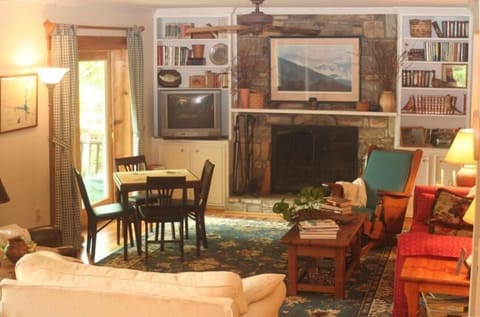 Downstairs living room, two armchairs, 3 seat sofa, 2 seat loveseat, game table.