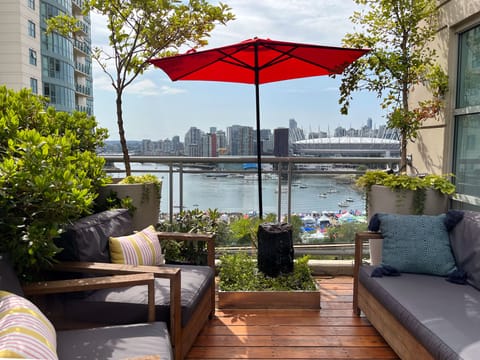 Patio with water feature and gorgeous view of False Creek, and BC Place Stadium.