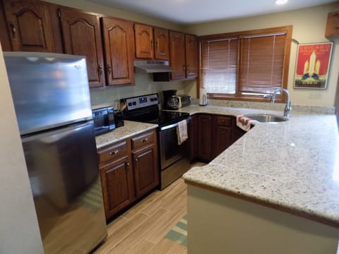 Kitchen area with granite countertops. All cooking utensils provided