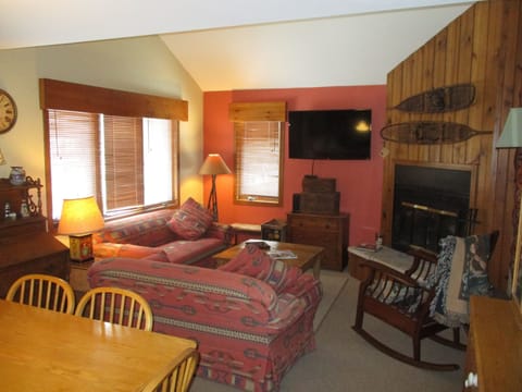 Main upper level living room. HDTV and wood burning fireplace