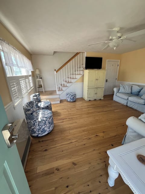 Living room, couch, loveseat, two swivel chairs