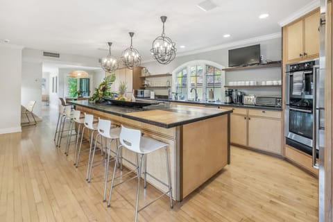 Bright kitchen design with modern lighting and plenty of counter space.
