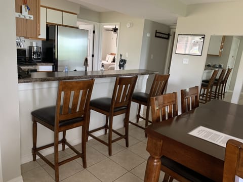 Another view of kitchen with bar seating 