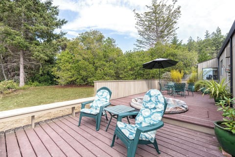 Back deck with hot tub and dining area