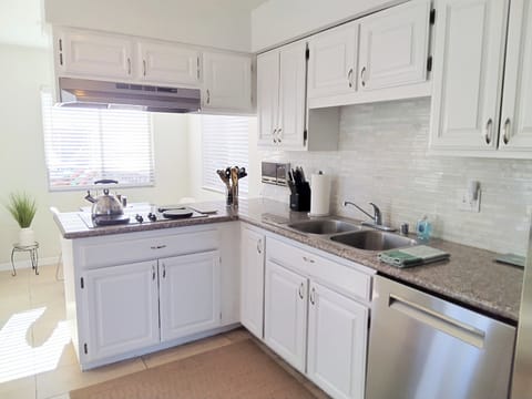 Full kitchen with new Bosch dishwasher.