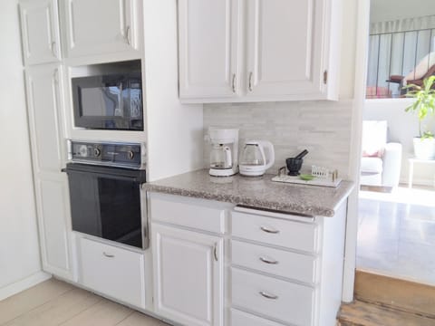 Kitchen oven absolutely coffee area.