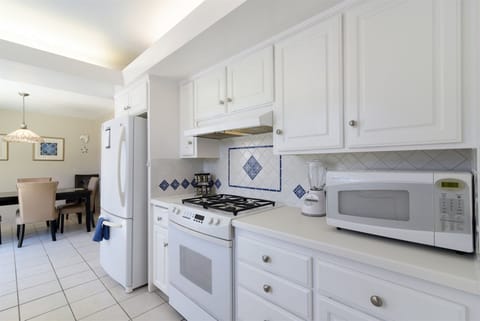 The kitchen is open to the dining area