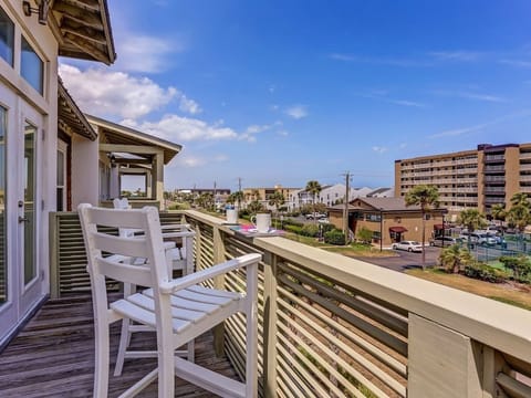 Balcony off the living room with comfy chairs - good place for morning coffee!