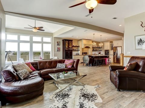 Looking from living area by TV toward kitchen and second sitting area