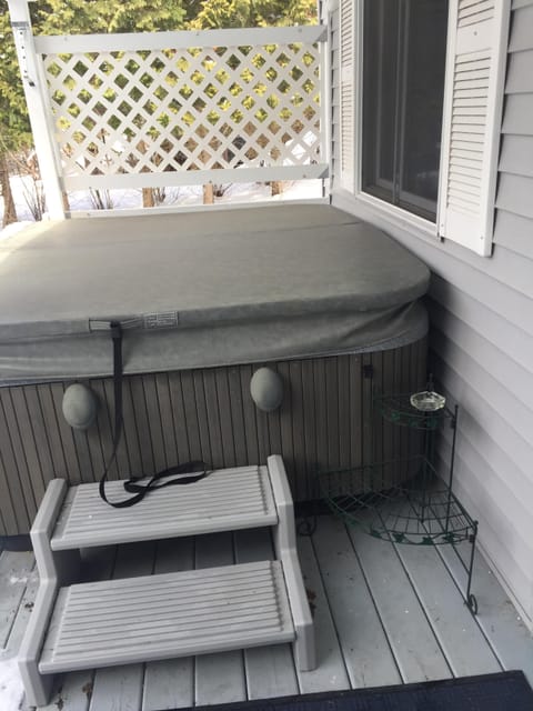 hot tub on covered porch open year round