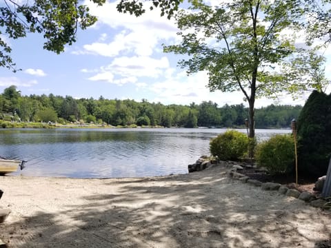 Private beach with beach chairs, 2 kayaks, rowboat, and canoe for your use. 