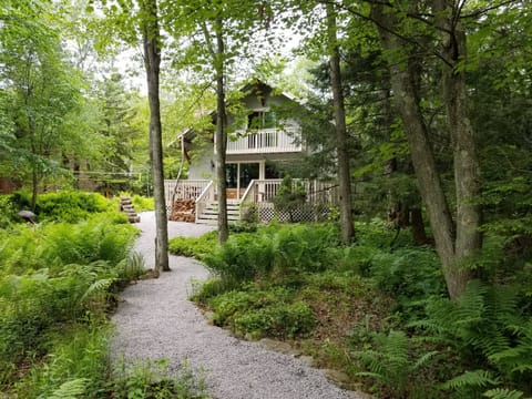 Back of house from winding path...just a few steps to your own private beach