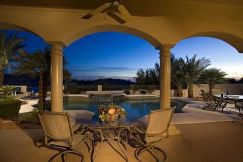 View from Entertainment Room to Patio, Private Heated Pool and Hot tub  @ Dusk
