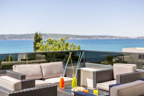 Rattan furniture with panoramic sea view.