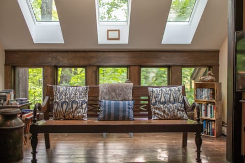 Atrium off living room has new windows & skylights and has books, DVDs & games.