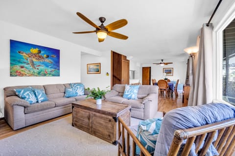 Spacious living room with ocean breezes and tropical garden view 