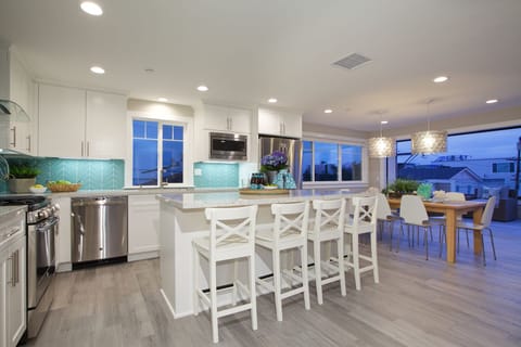 Upper unit: 3rd level - fully equipped gourmet kitchen with finest appliances, there is also a half bath on this level