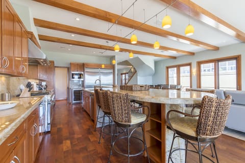 This kitchen is enormous! It is fully stocked with all cooking supplies!