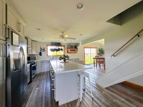 Gorgeous kitchen in Unit B with stainless steel appliances, lots of counter space, and extra seating.