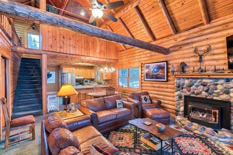 Relax in the inviting living room while you enjoy the warmth of the river rock fireplace.