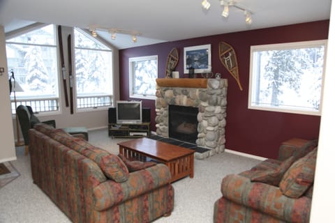 Main living room is relaxing with a gas fireplace, seating, cable TV, WIFI.