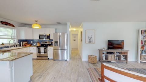 Open concept living, kitchen, and dining room for easy beach living!