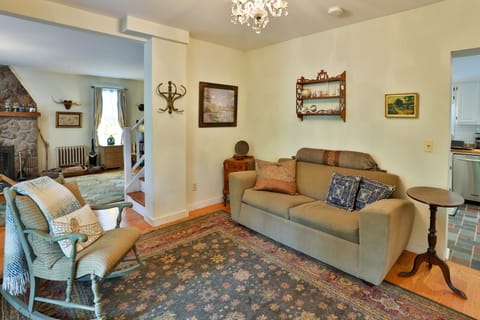 Front room has double pull-out bed in couch and antiques