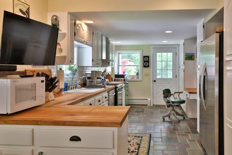 Rock Maple countertops and KitchenAid refrigerator with through-the-door ice