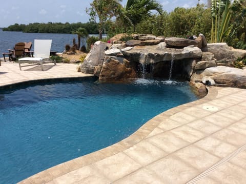 Resort style pool with waterfall