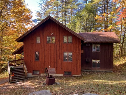 Top of driveway in the fall with steps leading down to house