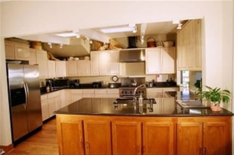 open,airy kitchen with gas stove,double door fridge microwave,  and fully stocke