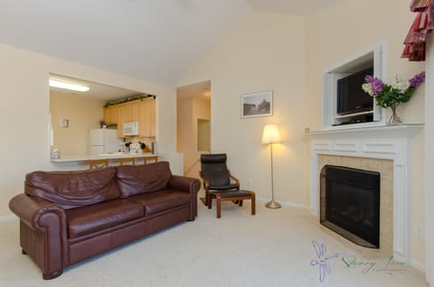 Living room sleeper sofa, fire place, tv, table seats 3 or 4 2 chairs, balcony 