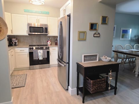 Kitchen with brand new cabinets, stainless steel appliances & work station sink
