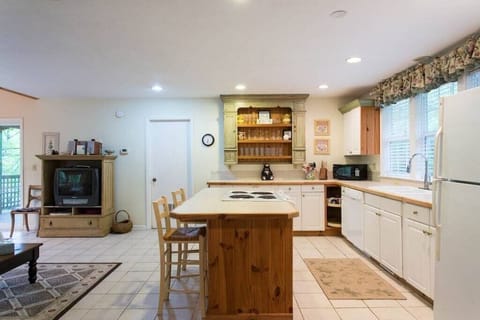 The kitchen is fully equipped with all of the necessary appliances including a dishwasher.