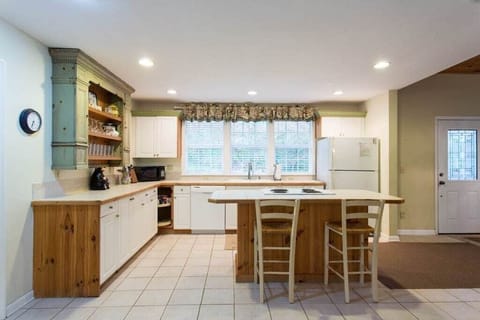 There is ample storage and a breakfast bar with seating for 2.