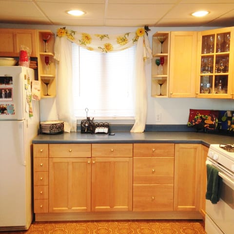 Kitchen has island that opens to living area (not shown) 2 stools provided.