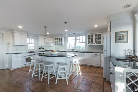 Gourmet kitchen with space  for multiple  chefs. Well  stocked.