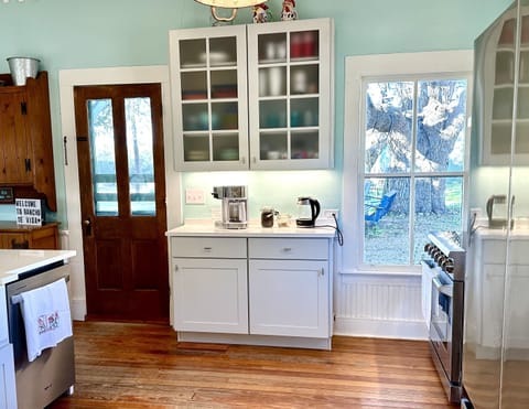 Coffee and tea station in kitchen.
