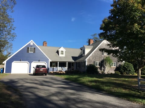 Exterior house view, appropriately painted "salty dog" blue.