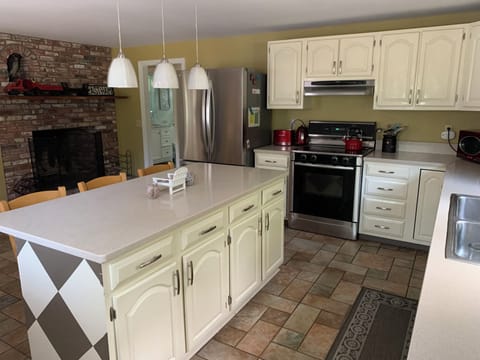 Kitchen, looking towards wood burning fireplace