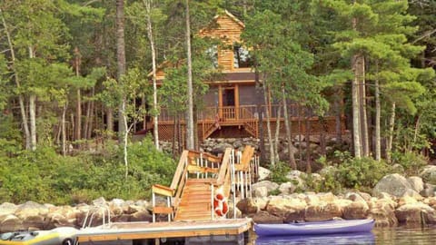 1995 photo. Today, vegetation has filled in and cabin is less visible from lake.