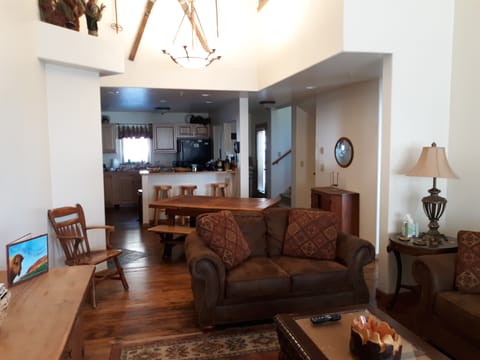 View from vaulted Living room towards Kitchen.  New Hardwood Flooring
