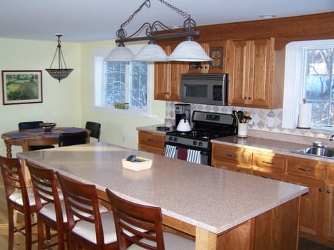 The 8-foot island is a wonderful space to prepare and serve food with others.