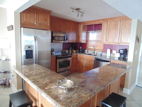 Fully stocked and updated kitchen with 'eat-ledge' with 4 stools