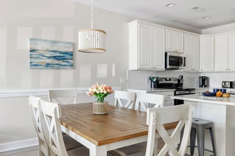 Dining table with seating for six to enjoy a meal together.