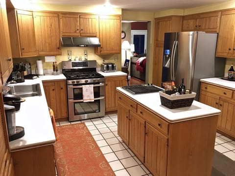 Large kitchen with stainless steel appliances and plenty of cupboard space