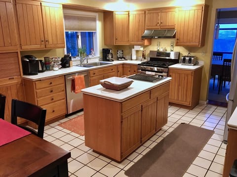 Large kitchen with gas range, Jennair cooktop, microwave & coffee station