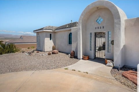 Front courtyard entrance and parking on gravel lot