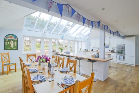 Large kitchen and dining area leading into the back garden